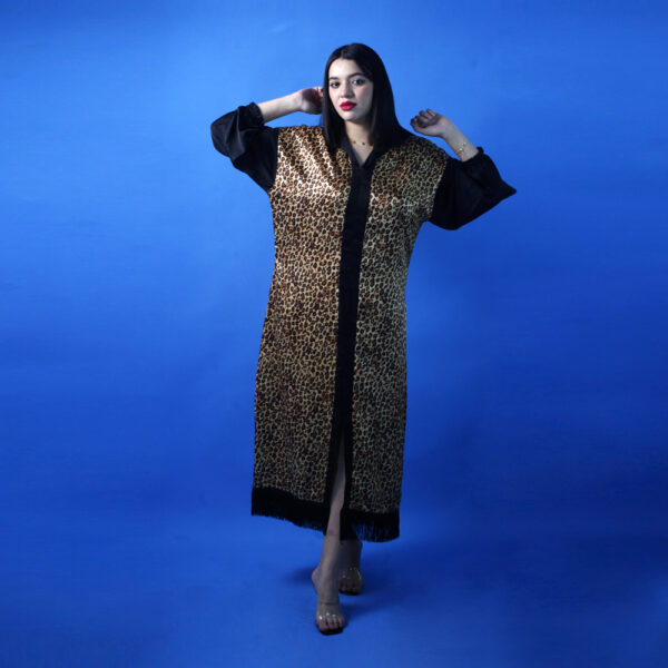 Leopard print Djellaba with bishop sleeves.